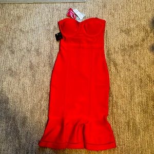 Beautiful red dress by Bebe never been worn and with tag